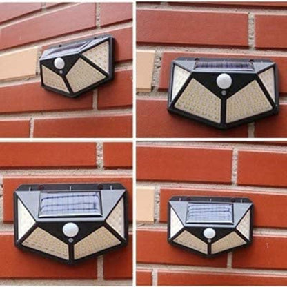 A four-panel collage showing the same wall-mounted solar outdoor light from different angles, mounted on a red brick wall. The fixture is black with beige/cream geometric panels and a visible solar panel on top.